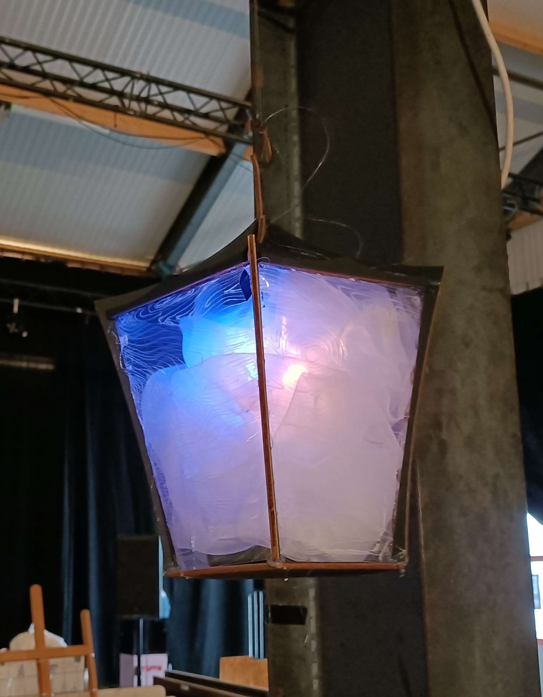 A lantern lit with blue light